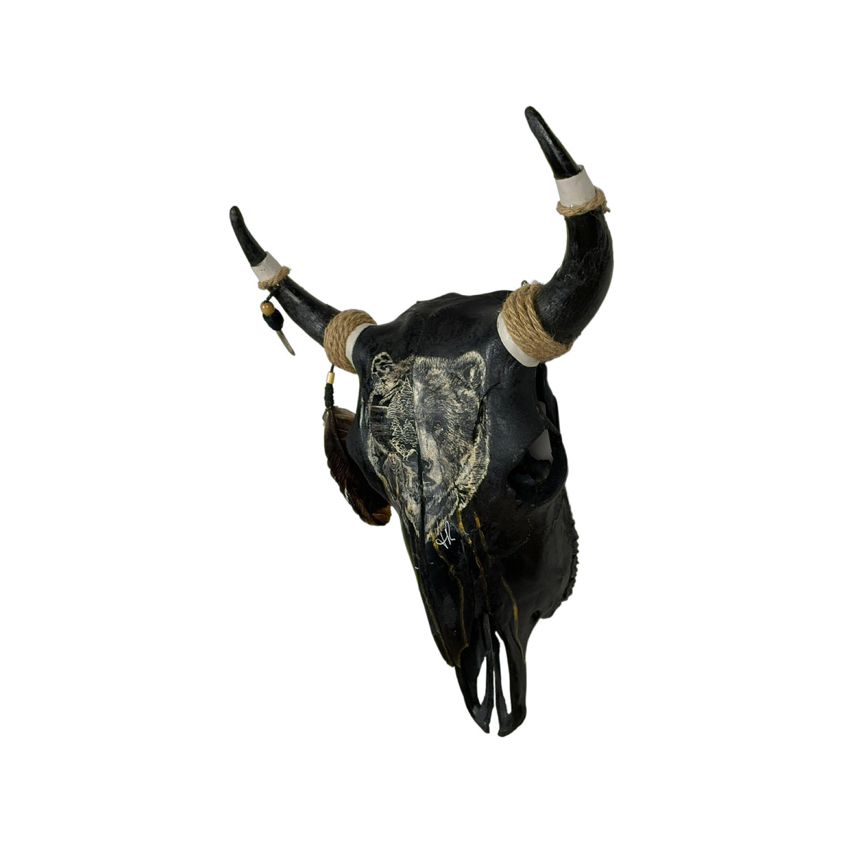 A Young Bull Engraved Skull Taxidermy Wall Decor featuring a bear head and a landscape