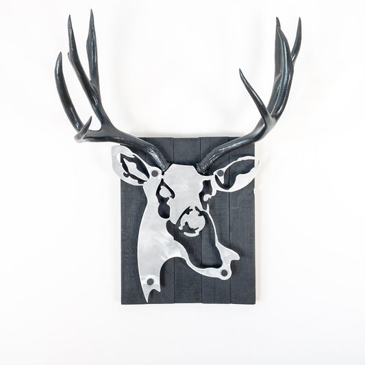 A metal wall decor made from real ethically sourced  Mule Deer antlers mounted on a metal head