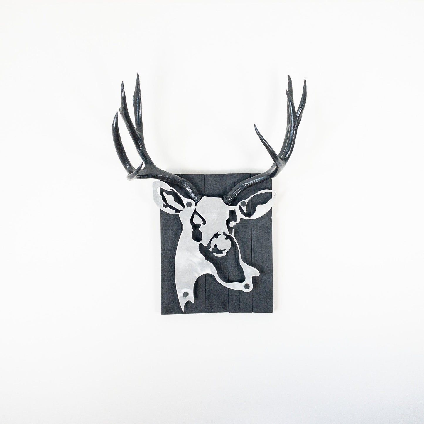 A metal wall decor made from real ethically sourced  Mule Deer antlers mounted on a metal head