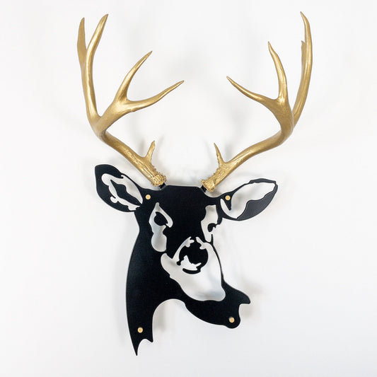 A metal wall decor made from real ethically sourced  Mule Deer antlers mounted on a metal head