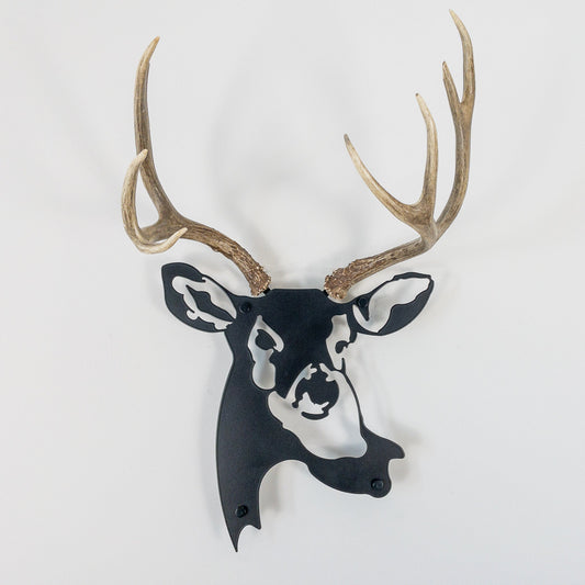 A metal wall decor made from real ethically sourced  Mule Deer antlers mounted on a metal head