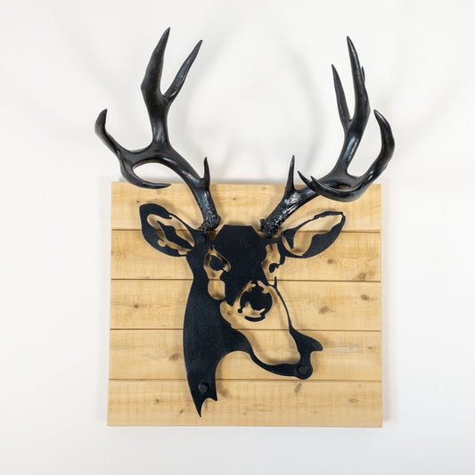 A metal wall decor made from real ethically sourced  Mule Deer antlers mounted on a metal head