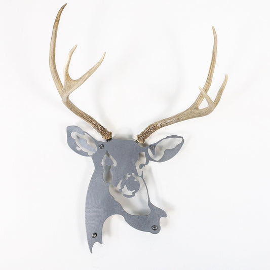 A metal wall decor made from real shed  Mule Deer antlers mounted on a metal head