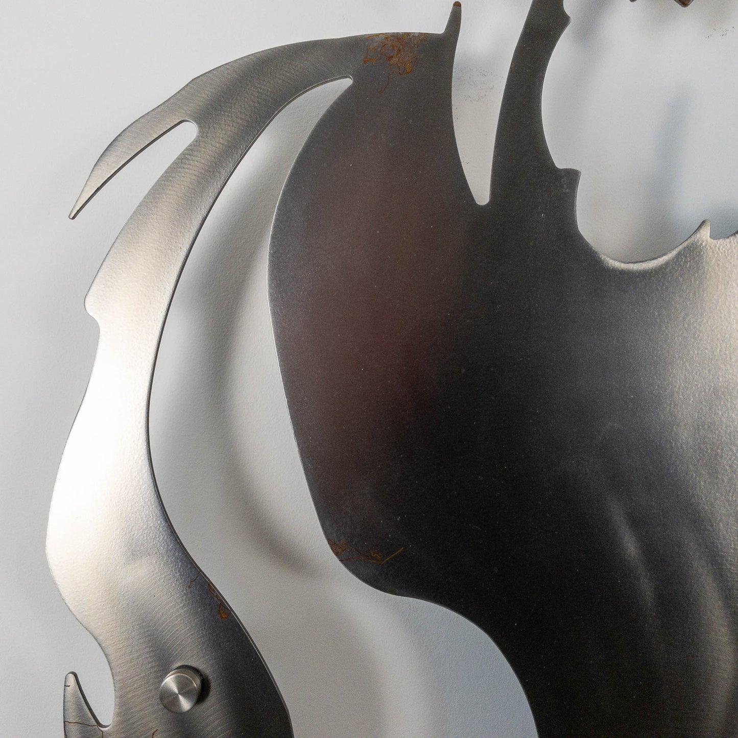 A metal wall decor made from real ethically sourced  White-Tailed Deer antlers mounted on a metal head