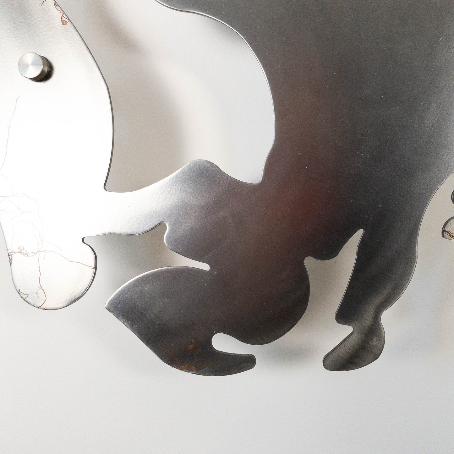A metal wall decor made from real ethically sourced  White-Tailed Deer antlers mounted on a metal head