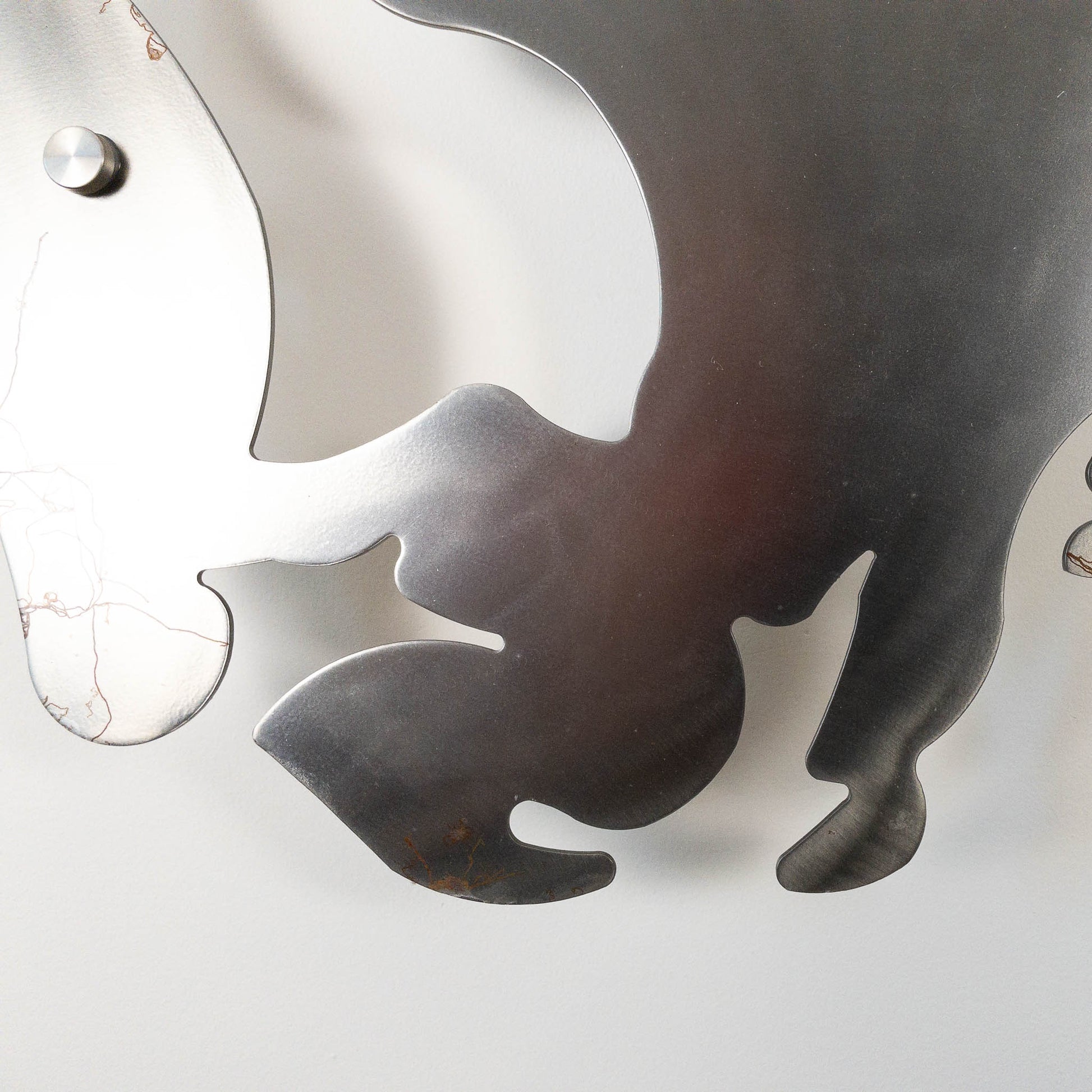 A metal wall decor made from real ethically sourced  White-Tailed Deer antlers mounted on a metal head