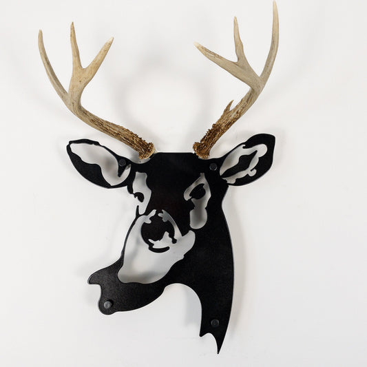 A metal wall decor made from real ethically sourced  White-Tailed Deer antlers mounted on a metal head