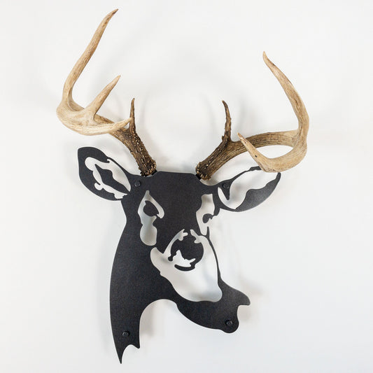 A metal wall decor made from real ethically sourced  White-Tailed Deer antlers mounted on a metal head