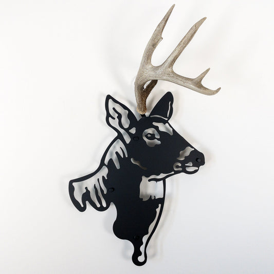 A metal wall decor made from real shed  White-Tailed Deer antlers mounted on a metal head