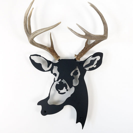 A metal wall decor made from real shed  White-Tailed Deer antlers mounted on a metal head