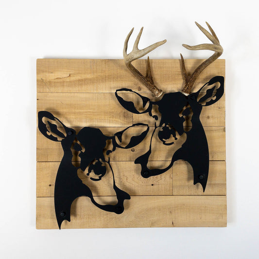 A metal wall decor made from real ethically sourced  White-Tailed Deer antlers mounted on a metal head