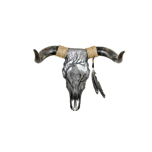 A Bull Engraved Skull Taxidermy Wall Decor featuring a crow perched on a tree