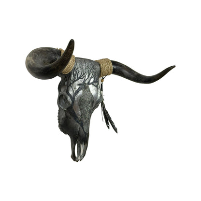 A Bull Engraved Skull Taxidermy Wall Decor featuring a crow perched on a tree