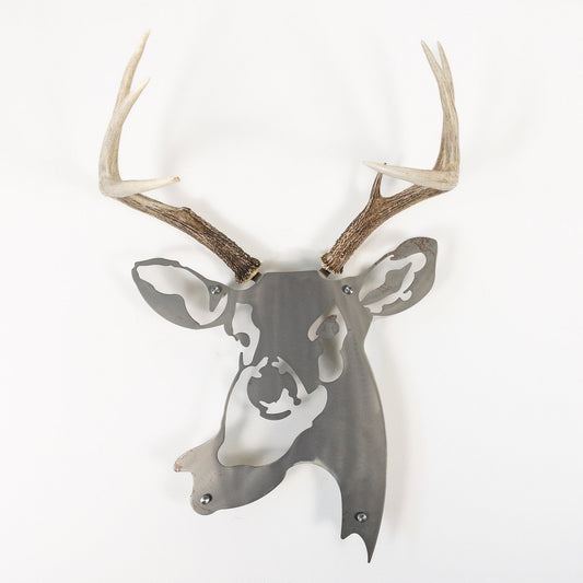 A metal wall decor made from real shed  White-Tailed Deer antlers mounted on a metal head